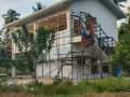 immaculate-white-house-in-the-middle-of-the-forest