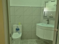 Maters-bathroom-with-lights-on-and-newly-installed-wash-basin