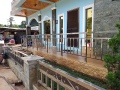 American-country-inspired-facade-with-stainless-rails